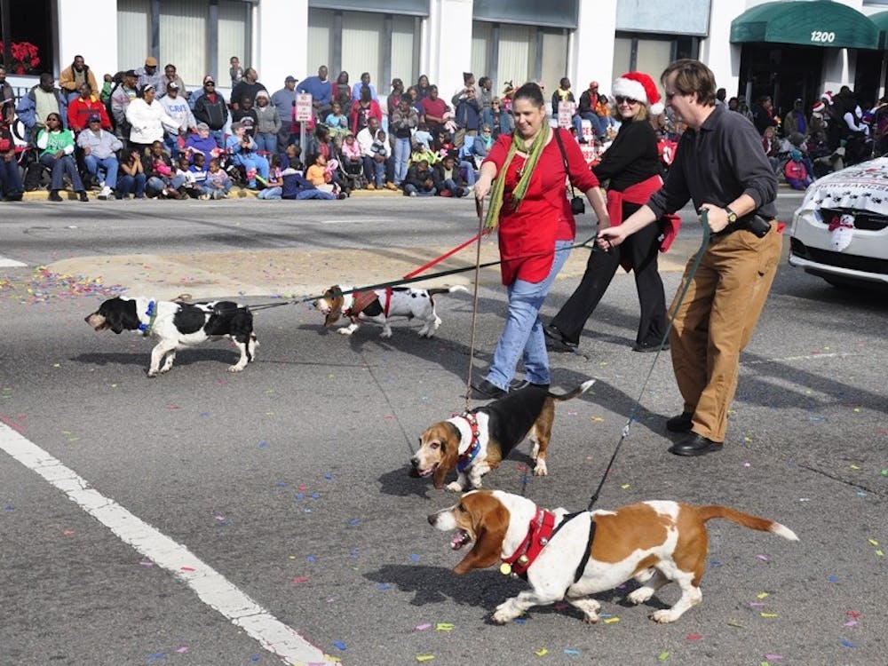 Packs of dogs, policemen and representatives of a variety of other Columbia-area organizations and businesses participate in the 59th annual Carolina Carillon parade.