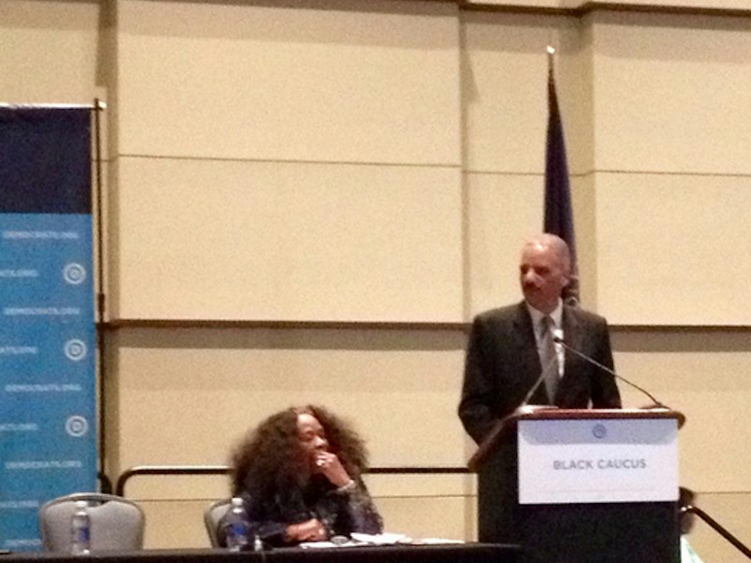 Former Attorney General Eric Holder addresses the black caucus at the Democratic National Convention in Philadelphia on July 27, 2016.