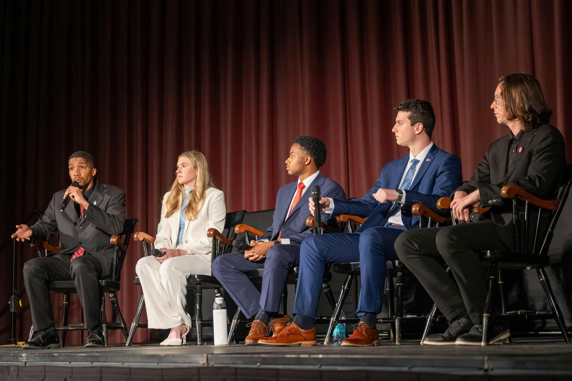 Fourth-year theatre student Bradley Gittens, third-year neuroscience student Emma Strickland, third-year political science student Jordan Cooper, third-year risk management and insurance student Cole Rotondo and doctoral mechanical engineering student Jacob Whisenant sit on a stage in the Russell House Ballroom during the Student Government election debate on Feb. 19, 2026. The elections will take place Feb. 24-25.