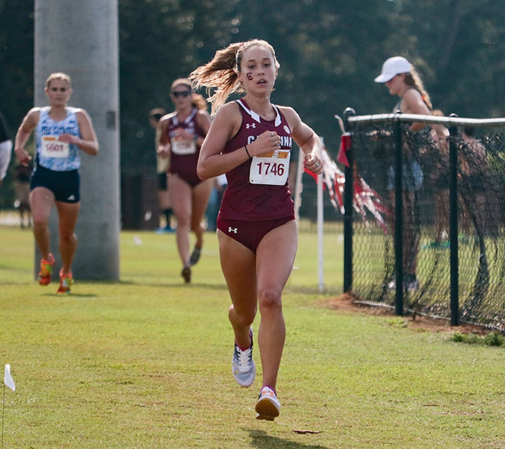 Senior Hannah Twine in front of a pack of runners at the Winthrop Invitational on Sept. 18, 2021.