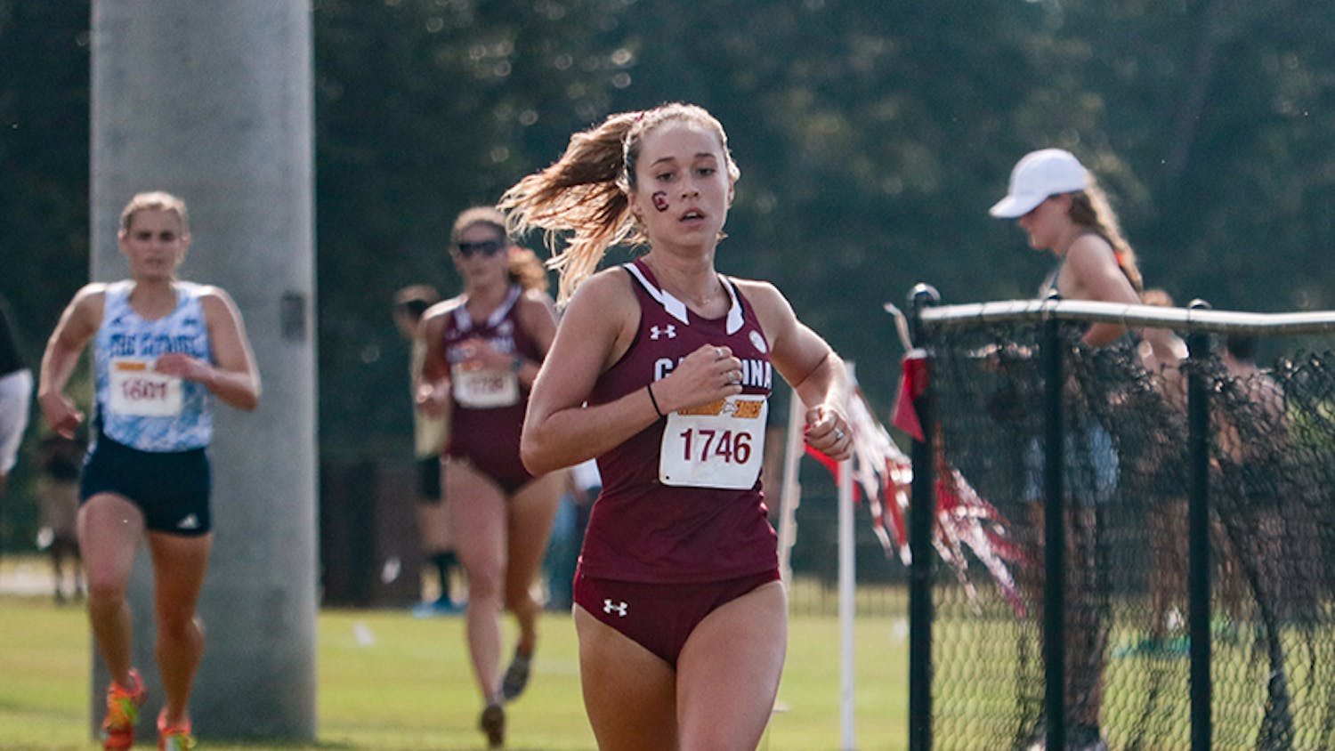 Senior Hannah Twine in front of a pack of runners at the Winthrop Invitational on Sept. 18, 2021.