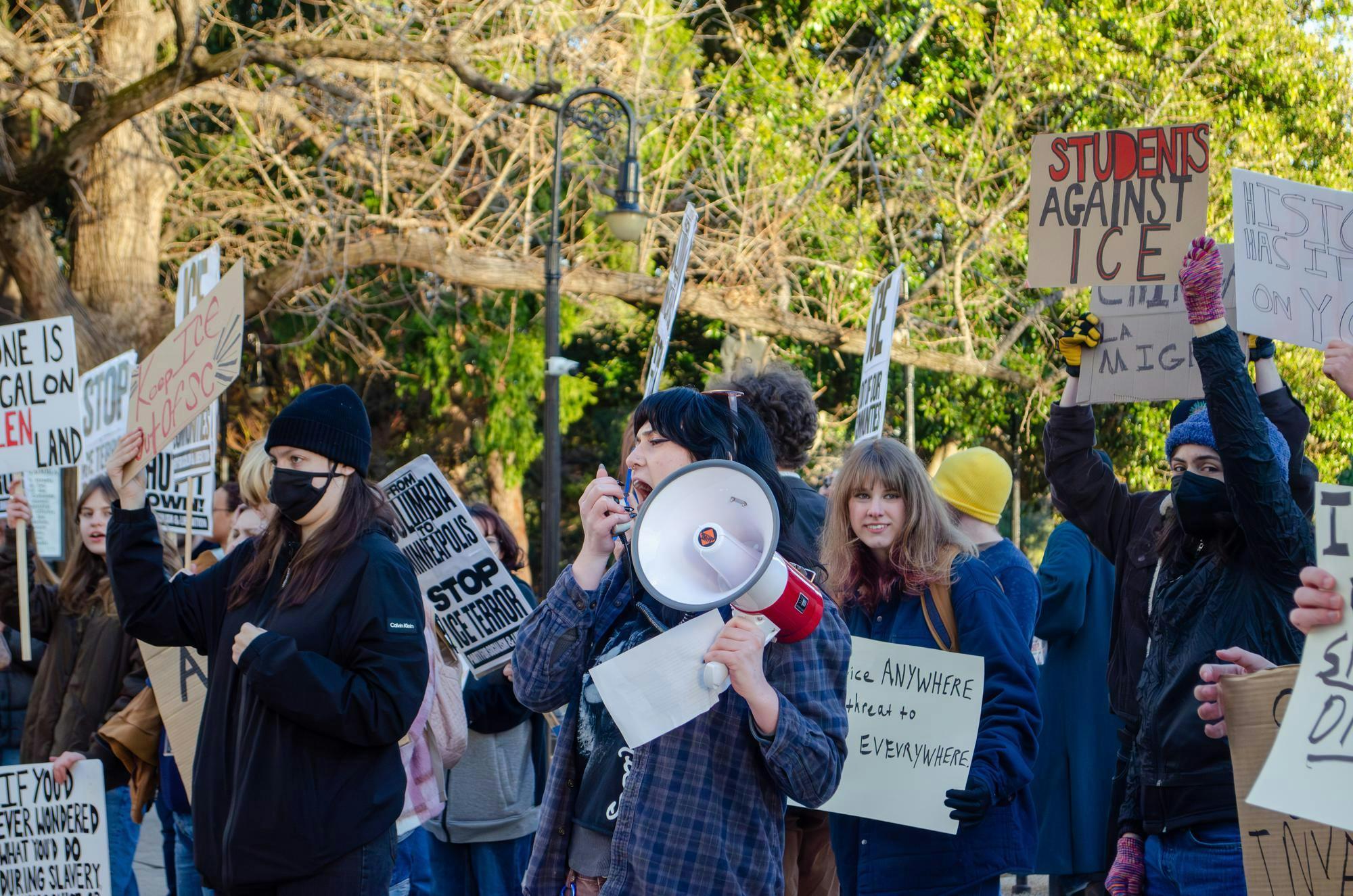 Quinnie Mustian leads protest chants at a protest at the statehouse in Columbia, South Carolina, on Jan. 20, 2026. The protesters, largely students, hold signs opposing the actions of U.S. Immigration and Customs Enforcement.