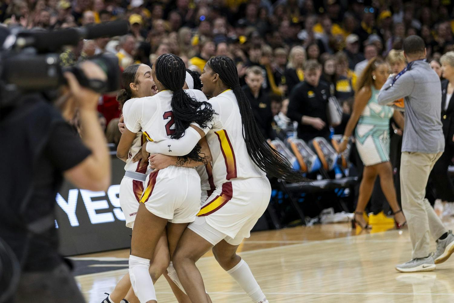 Freshman guard Tessa Johnson, junior guard Bree Hall, senior center Sakima Walker and senior guard Te-Hina Paopao hug in celebration after winning the national championship game. The Gamecocks completed a perfect, undefeated season ending in a national title for the first time in program history.