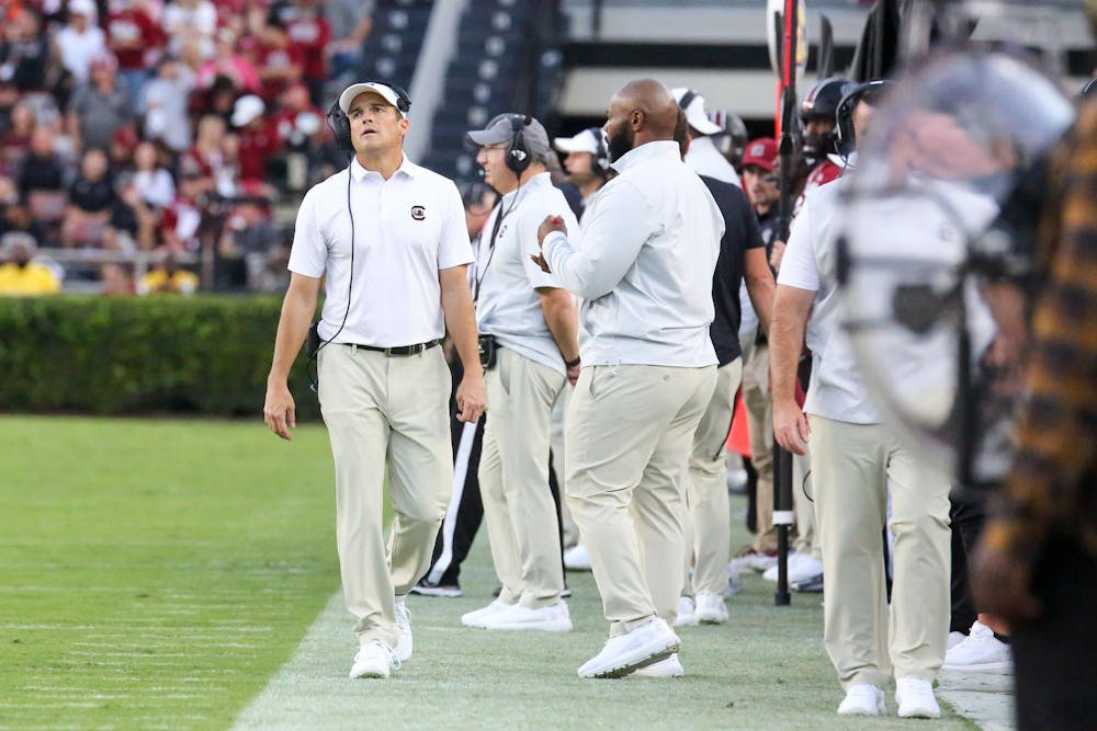 <p>Head coach Shane Beamer looks toward the scoreboard as he walks the sideline during South Carolina's game against Flordia on Oct. 14, 2023, at Williams-Brice Stadium. The Gamecocks lost to the Gators 41-39.</p>