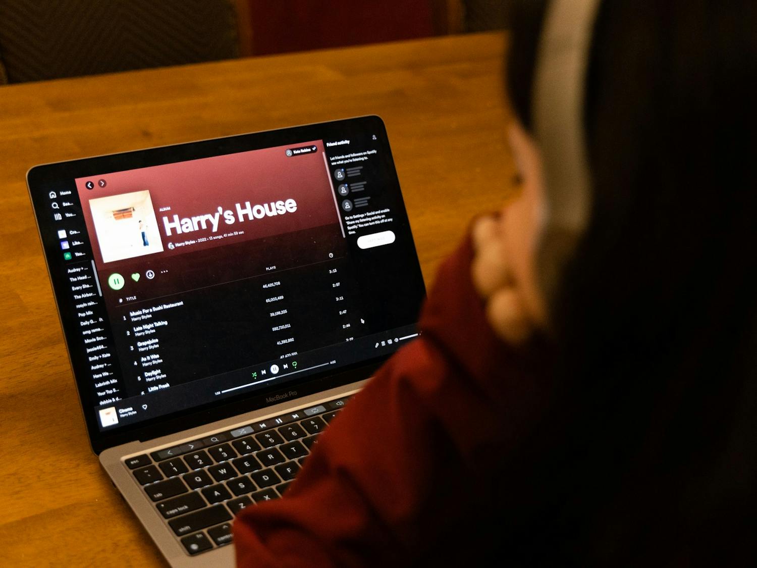A student listens to Harry Styles' new album, "Harry's House." The album was released on May 20, 2022. 
