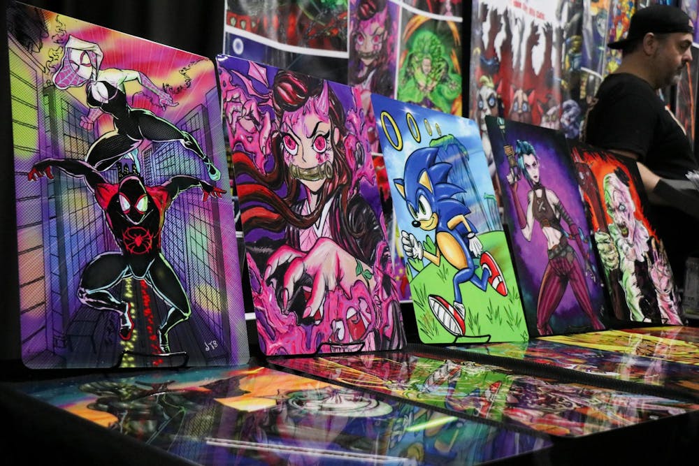 <p>A table full of posters of animated characters was one of many various vendors at the 2025 Comic Con on Jan. 12, 2025. Vendors ranged from people selling their artwork to celebrity guests such as Laz Alonso and Karan Ashley.</p>