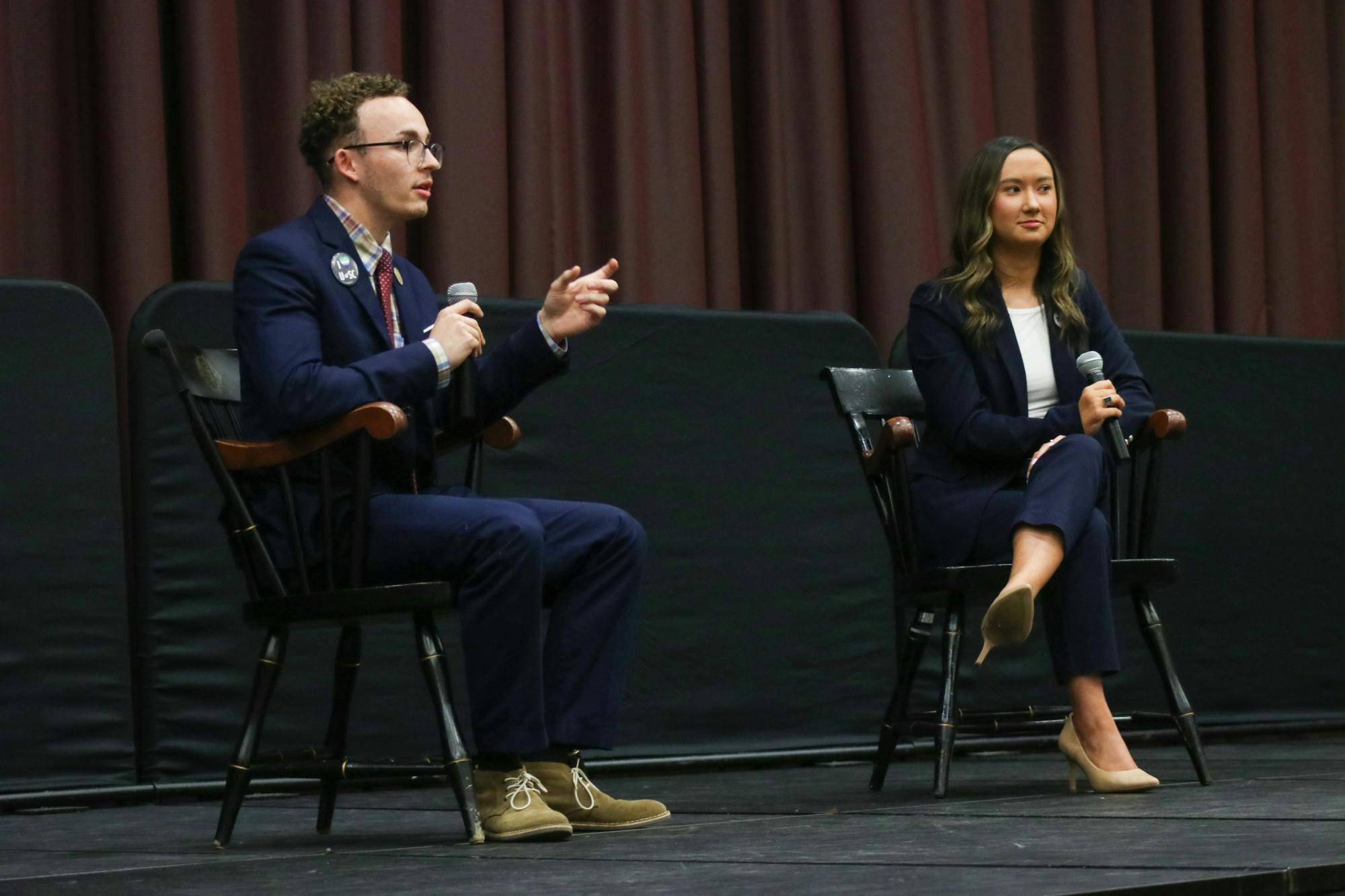 Student body presidential candidates third-year political science student Reilly Arford (left) and third-year public relations student Emily "Emmie" Thompson (right) on stage debating on Feb. 15, 2023. They are the only two presidential candidates this election season.&nbsp;