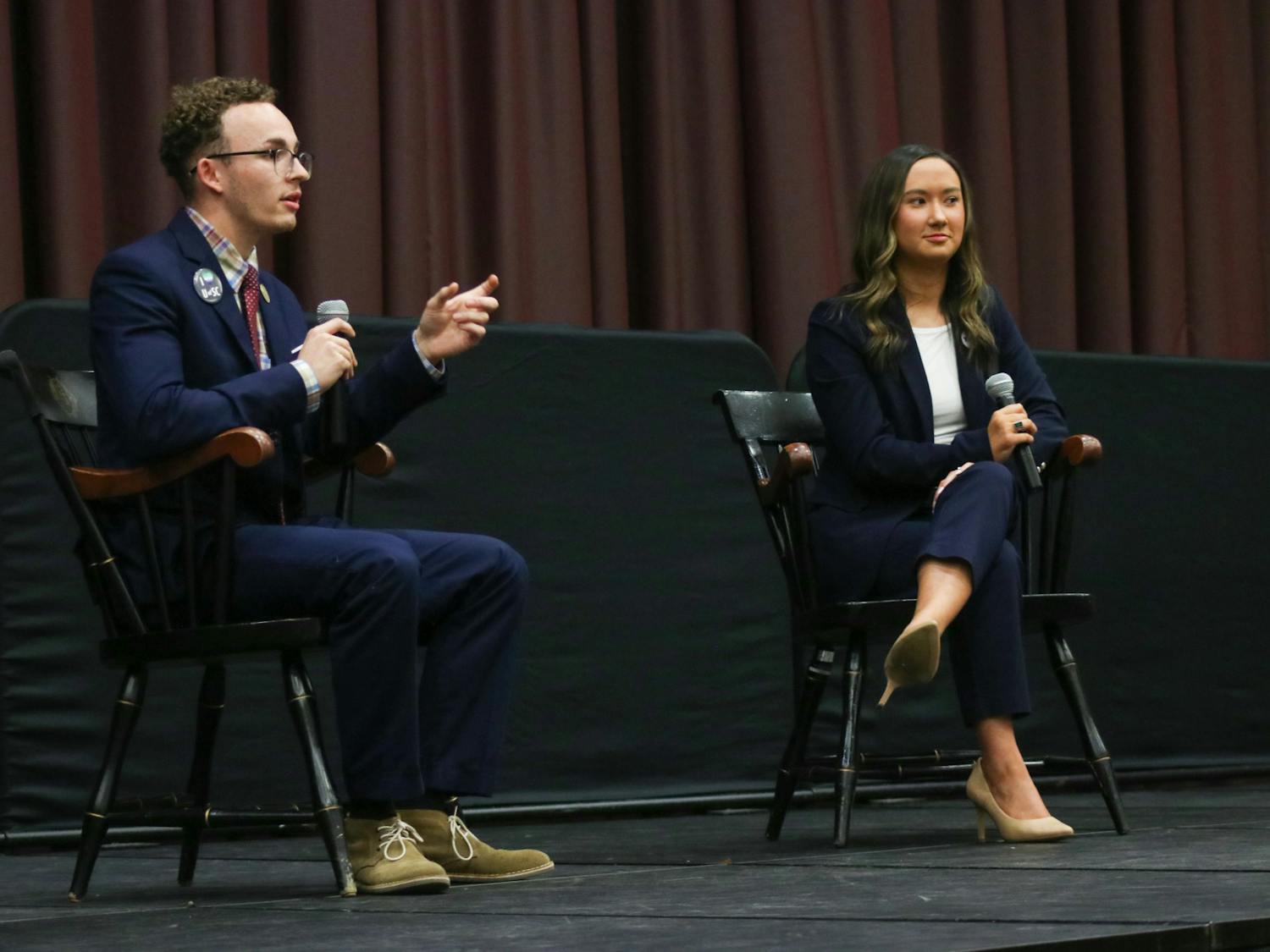 Student body presidential candidates third-year political science student Reilly Arford (left) and third-year public relations student Emily "Emmie" Thompson (right) on stage debating on Feb. 15, 2023. They are the only two presidential candidates this election season. 