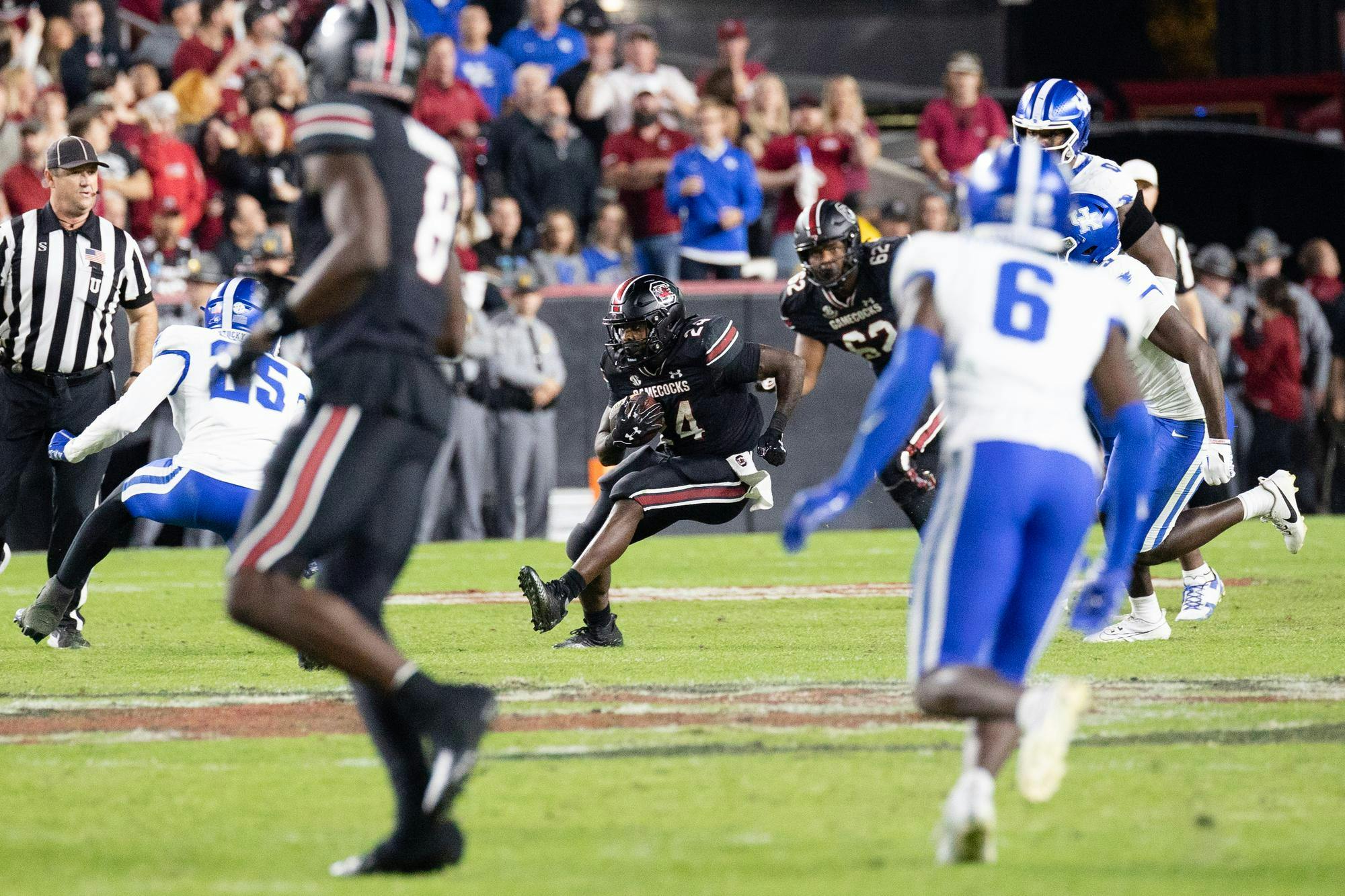 Redshirt senior running back Mario Anderson shifts directions to avoid Kentucky defenders. The Gamecocks defeated the Wildcats 17-14 and only have to win one more game to be bowl eligible in Shane Beamer's third season as head coach.