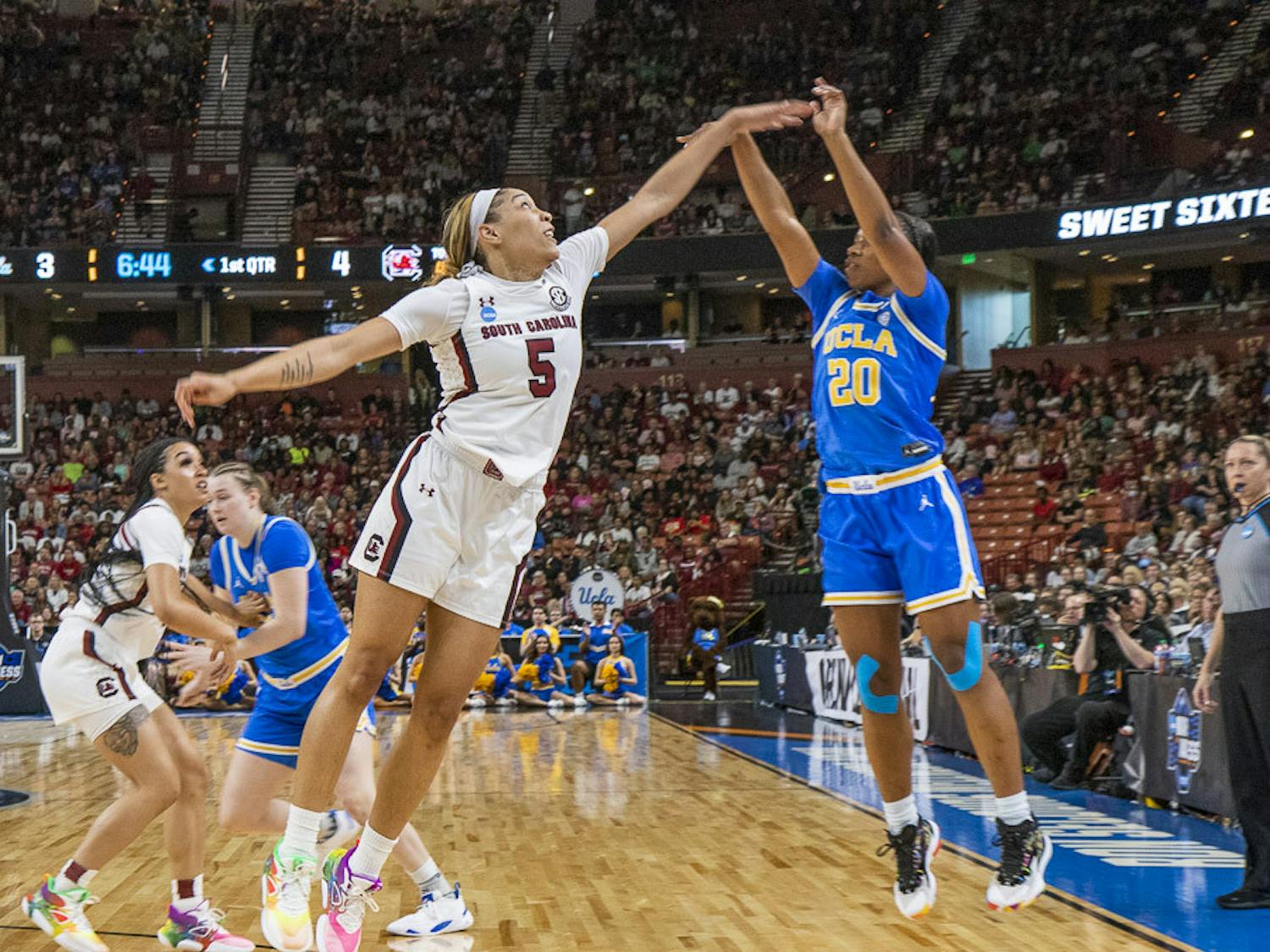 Senior forward Victaria Saxton attempts to block UCLA senior guard Charisma Osbourne's 3-point shot during the matchup between South Carolina and UCLA at Bon Secours Wellness Arena on March 25, 2023. The Gamecocks beat the Bruins 59-43 and will move on to the Elite Eight tournament.&nbsp;