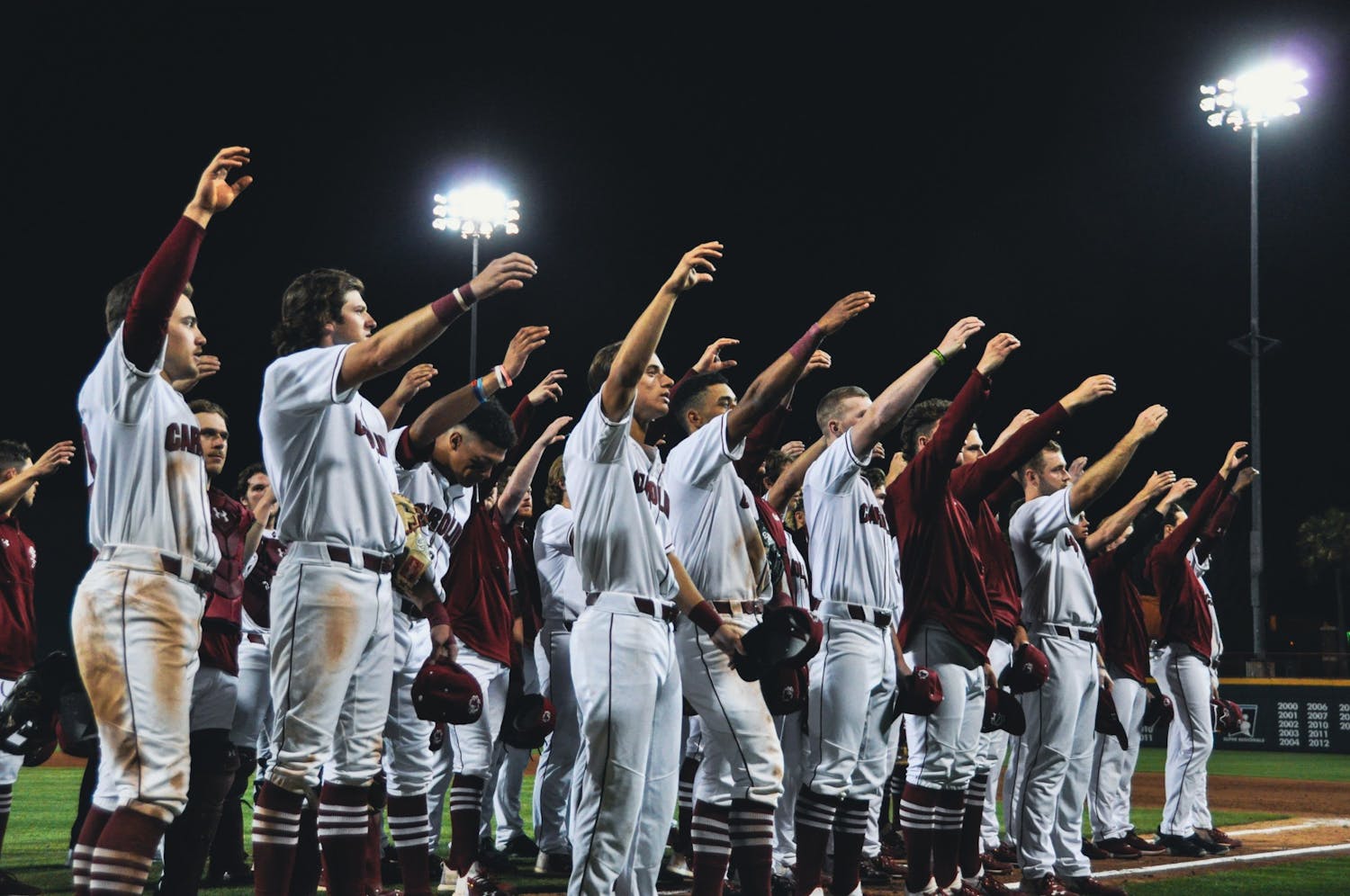 FILE—The South Carolina baseball team celebrates a victory delivering the alma mater on Sunday night, March 20, 2022.&nbsp;