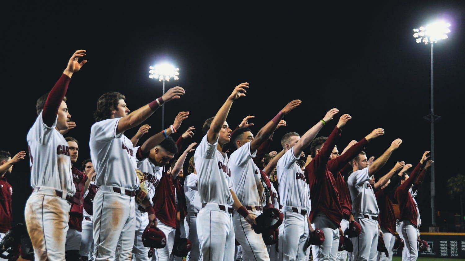 FILE—The South Carolina baseball team celebrates a victory delivering the alma mater on Sunday night, March 20, 2022.&nbsp;