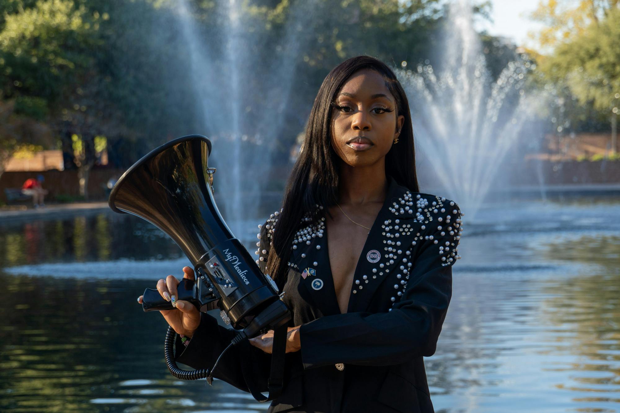 Fourth-year broadcast journalism student Courtney McClain poses with her megaphone outside the Thomas Cooper Library on Oct. 24, 2022. The junior lobbyist participates and organizes marches and events to combat the mistreatment of minorities, LGBTQIA+ groups and other groups that face discrimination.