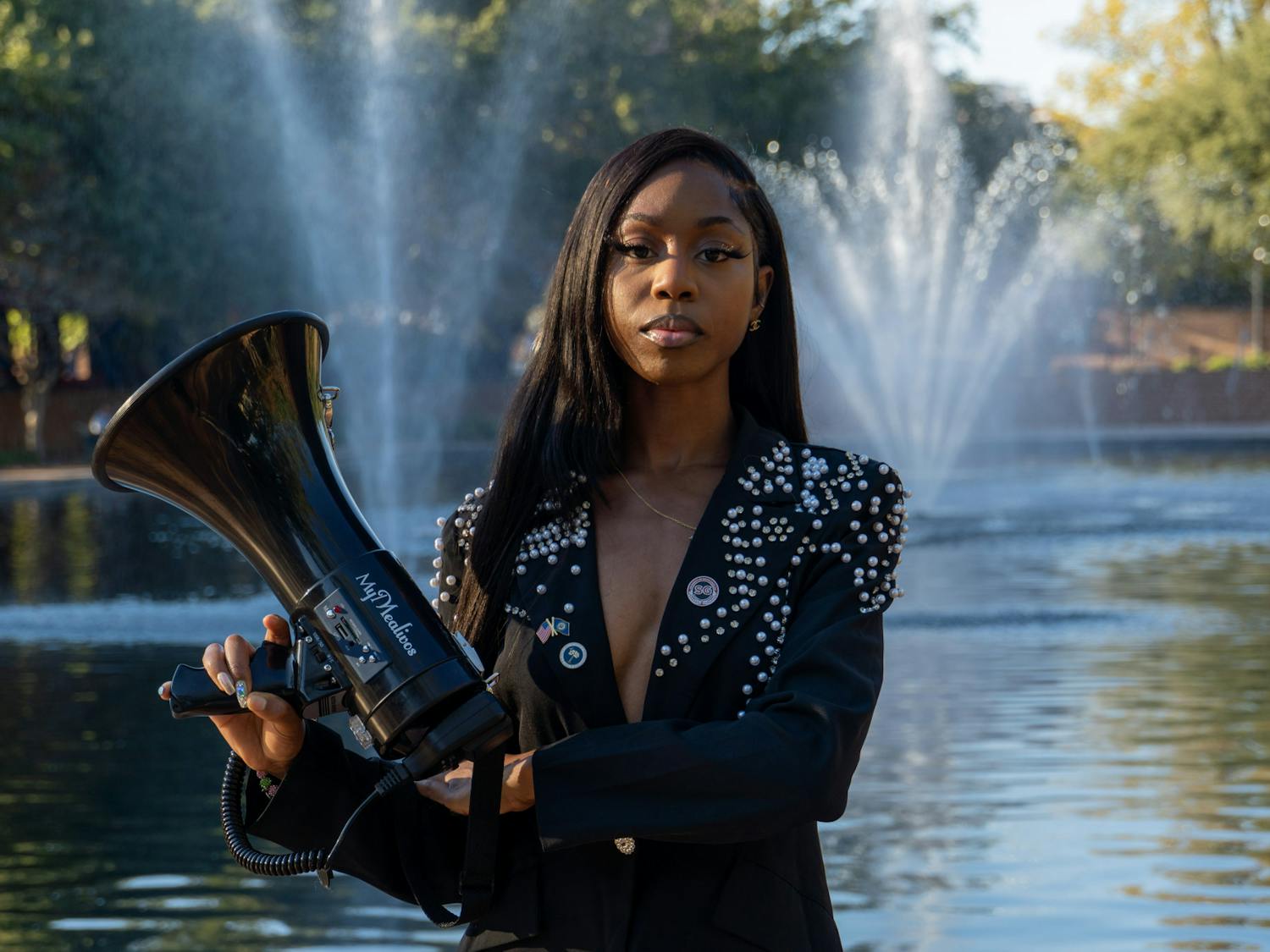 Fourth-year broadcast journalism student Courtney McClain poses with her megaphone outside the Thomas Cooper Library on Oct. 24, 2022. The junior lobbyist participates and organizes marches and events to combat the mistreatment of minorities, LGBTQIA+ groups and other groups that face discrimination.