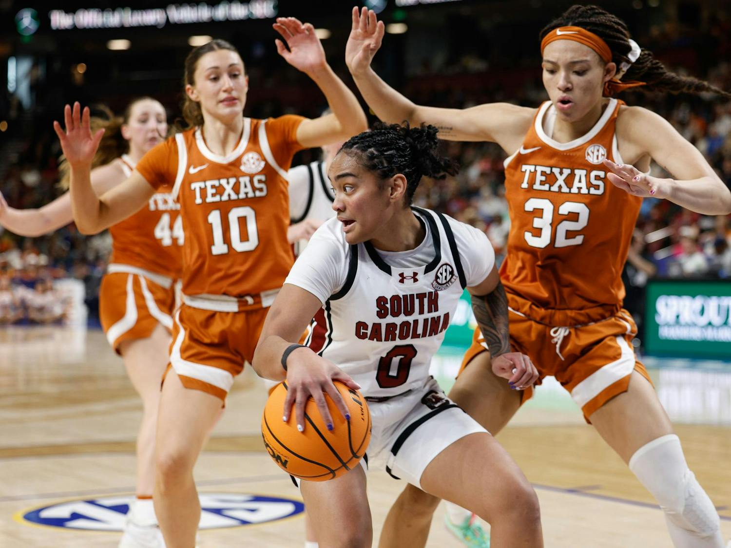 Senior guard Te-Hina Paopao maneuvers the ball against opposing players during the championship game against Texas at the SEC Tournament in Greenville, South Carolina on March 9, 2025. Paopao had five rebounds and contributed 4 points to the Gamecocks 64-45 win over the Longhorns.