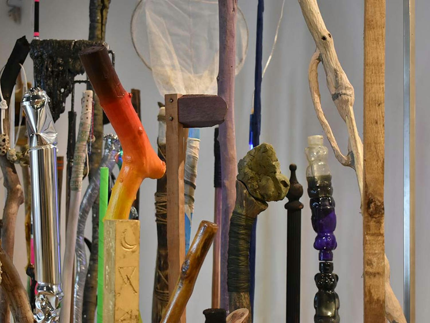 "Drifter History" by Christopher Mahonski is a collection of found and fabricated walking sticks inserted into individual metal bases. Each individual stick is made of a unique material and distinctive style.