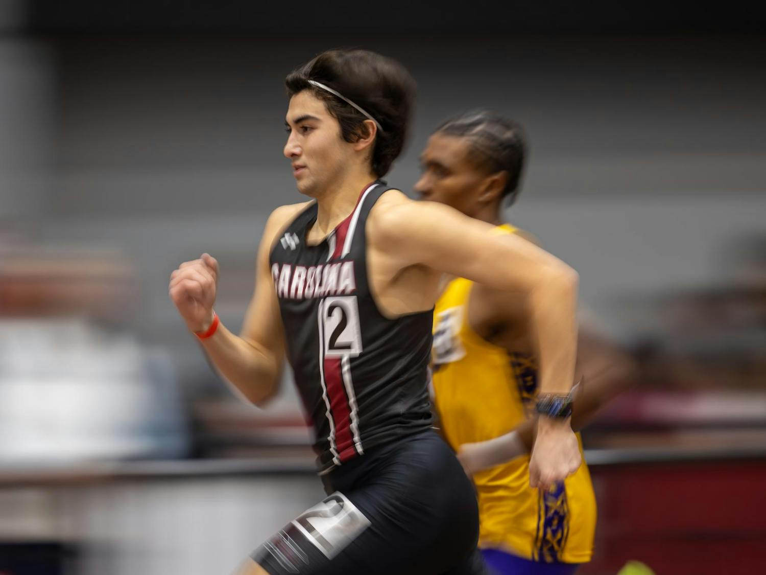 Junior middle distance runner Carlos Lanzagorta-Ruiz sprints down the track during the men's 800m at the Carolina Classic track and field meet on Feb. 6, 2026. After not finishing the 800m, Lanzagorta-Ruiz eventually finished second in the mile sprint.