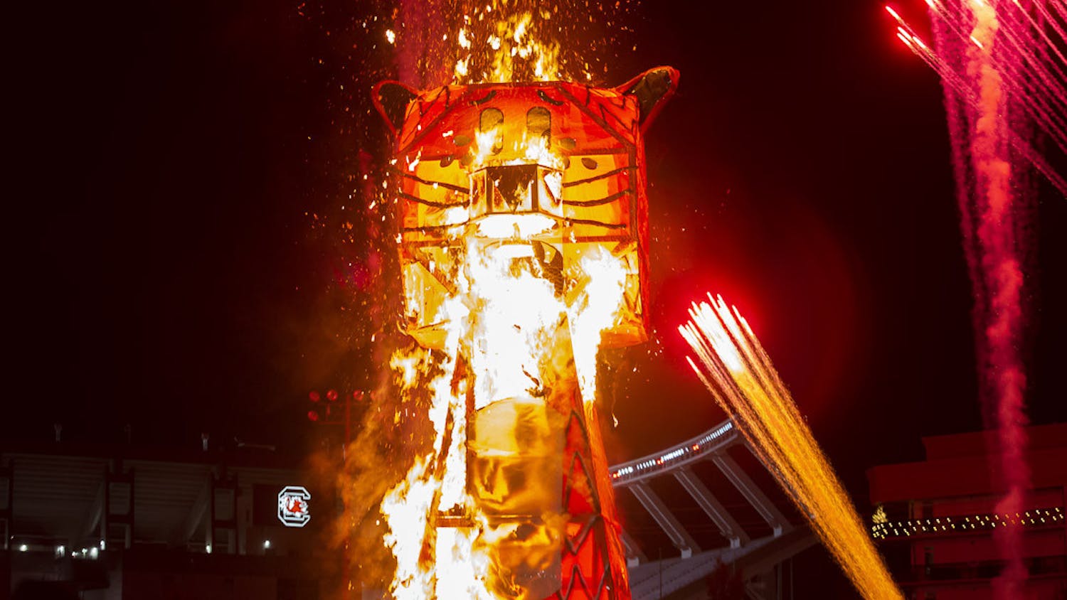 Flames quickly catch and spread throughout the 32.5-foot-tall tiger statue during the Tiger Burning ceremony at the Bluff Road intramural fields on Nov. 21, 2022. The annual event with the University of South Carolina engineering department marks the beginning of rivalry week in preparation for the South Carolina and Clemson football game.