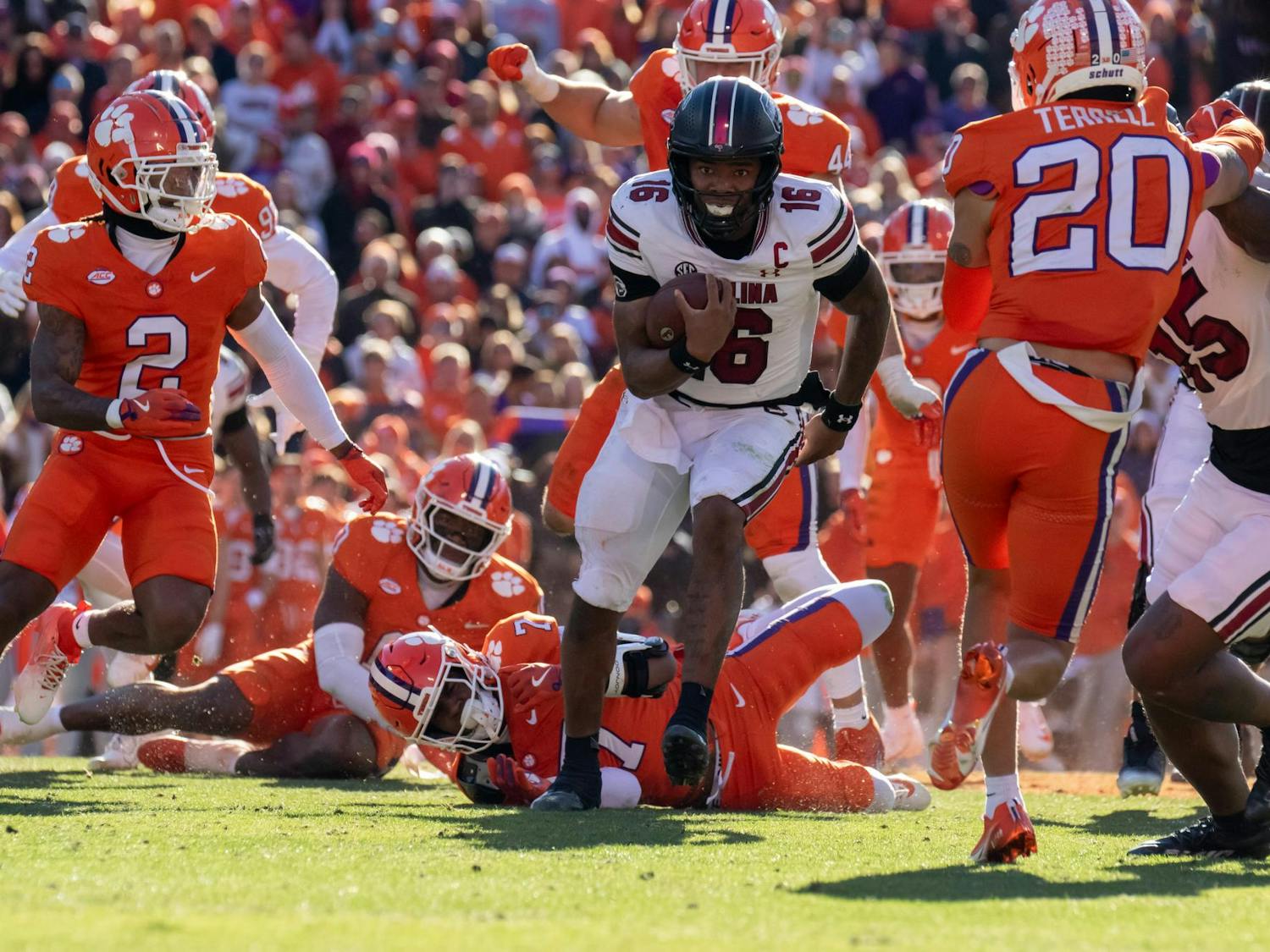 Redshirt freshman quarterback LaNorris Sellers runs through Clemson defenders on Nov. 30, 2024. Sellers set a season high of two rushing touchdowns with a total of 166 rushing yards for the game.