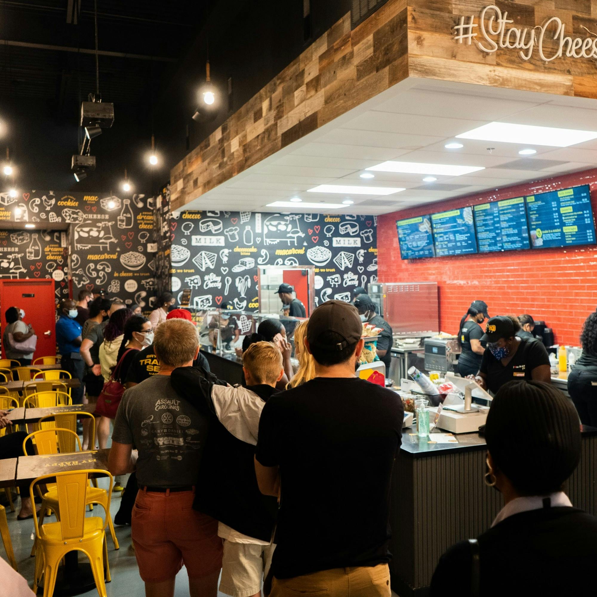 Customers wait in a line at the newly opened Restaurant I Heart Mac & Cheese. 