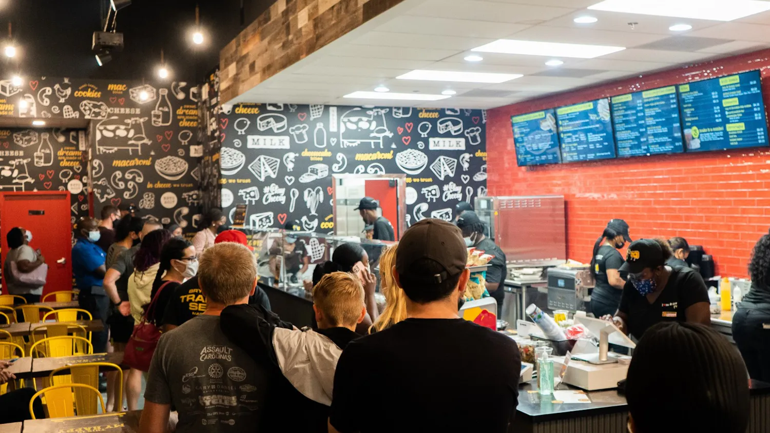 Customers wait in a line at the newly opened Restaurant I Heart Mac & Cheese.