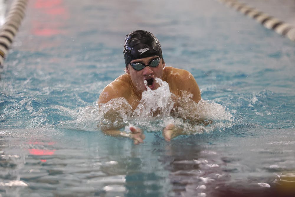 <p>Junior Daniel West swims breaststroke during the meet against LSU on Oct. 8, 2022. West and his 200-medley teammates, seniors Guy Groper and Mark Shperkin broke the record set in 2019 with a time of 1:24.40 during the SEC Swimming and Diving Championships in College Station, Texas, from Feb. 14 to 18, 2023.&nbsp;</p>