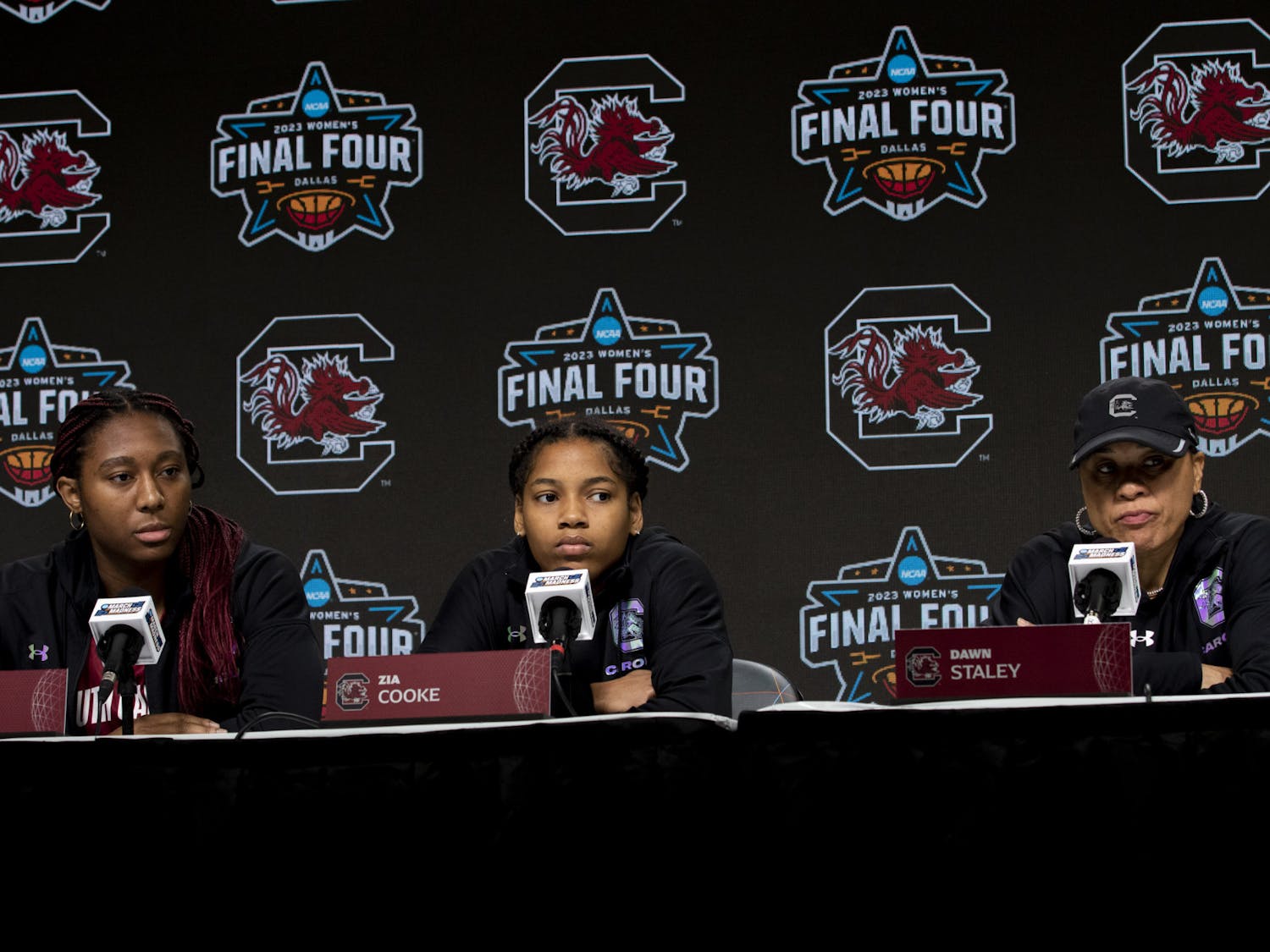Senior guard Zia Cooke, senior forward Aliyah Boston and head coach Dawn Staley keep a stern composure while listening to the media's questions at the Women’s Final Four Pregame Press Conference on March 30, 2023, in Dallas, Texas. This is Staley’s third consecutive year leading the Gamecocks to the Final Four.&nbsp;