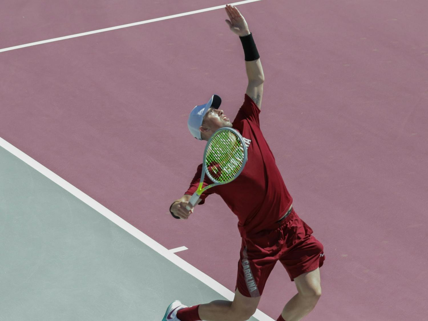 Sophomore Connor Thompson serves the ball at the Carolina Tennis Center on Sunday March 20, 2022. The Gamecocks defeated the Ole Miss Rebels 6-1.