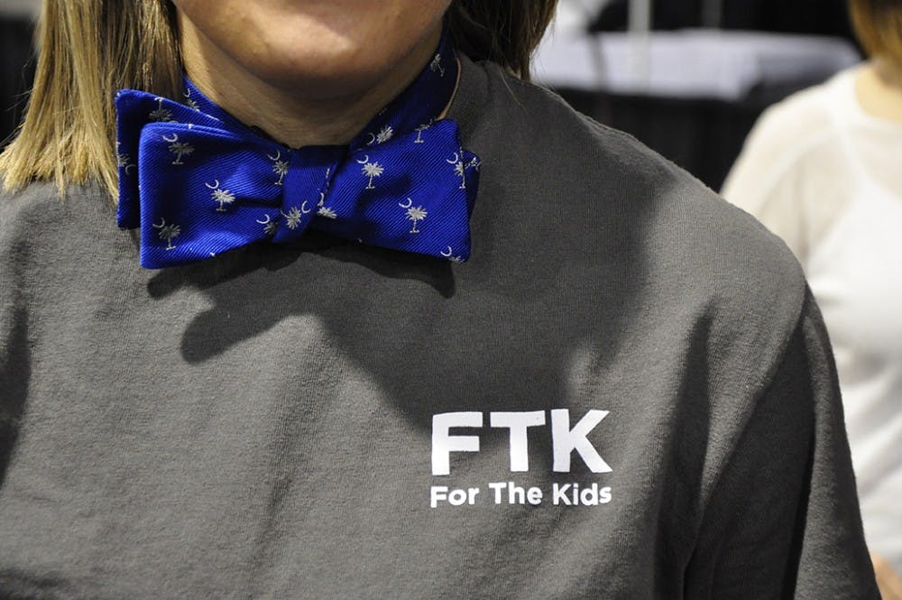 	The Guinness World Record for most bow ties tied at once was broken by USC students Sunday at Tie Us Together event at the Columbia Metropolitan Covention Center. USC Dance Marathon hosted the event in support of Palmetto Health Children&#8217;s Hospital, Columbia&#8217;s local Children&#8217;s Miracle Network Hospital.

	The original idea came from Britton&#8217;s co-owner Lucky Levinson, who then brought the idea to Dance Marathon. Britton&#8217;s arranged for a Guinness World Records observer to attend, and as of 4 p.m. Sunday, the new record is 820 bowties tied at one time.

	Photos by Brian Almond/ The Daily Gamecock