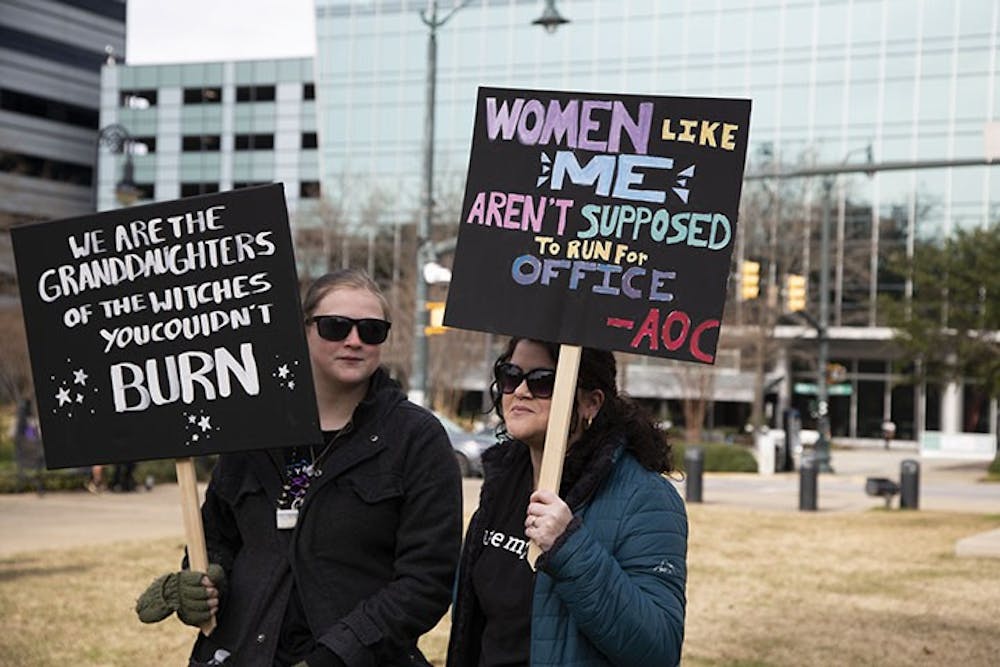 <p>Emily Gunning, National lines on Mental Illness and Rachel Oxley, Receptionist</p>
<p>Emily Gunning (right) and Rachel Oxley (left), holding their signs during the march, were there to show their opinions on women’s rights.</p>