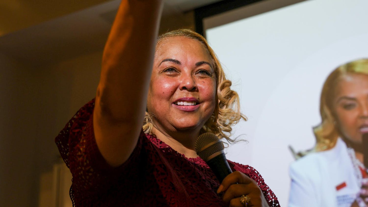 Moms Demand Action advocate Melody McFadden points towards a member of the audience while speaking during "The ART of Womanhood" event at the School of Art and Design on April 22, 2025. McFadden was the keynote speaker for the counter-event to Uncensored America’s “Why Woman Deserve Less” event with Myron Gaines.