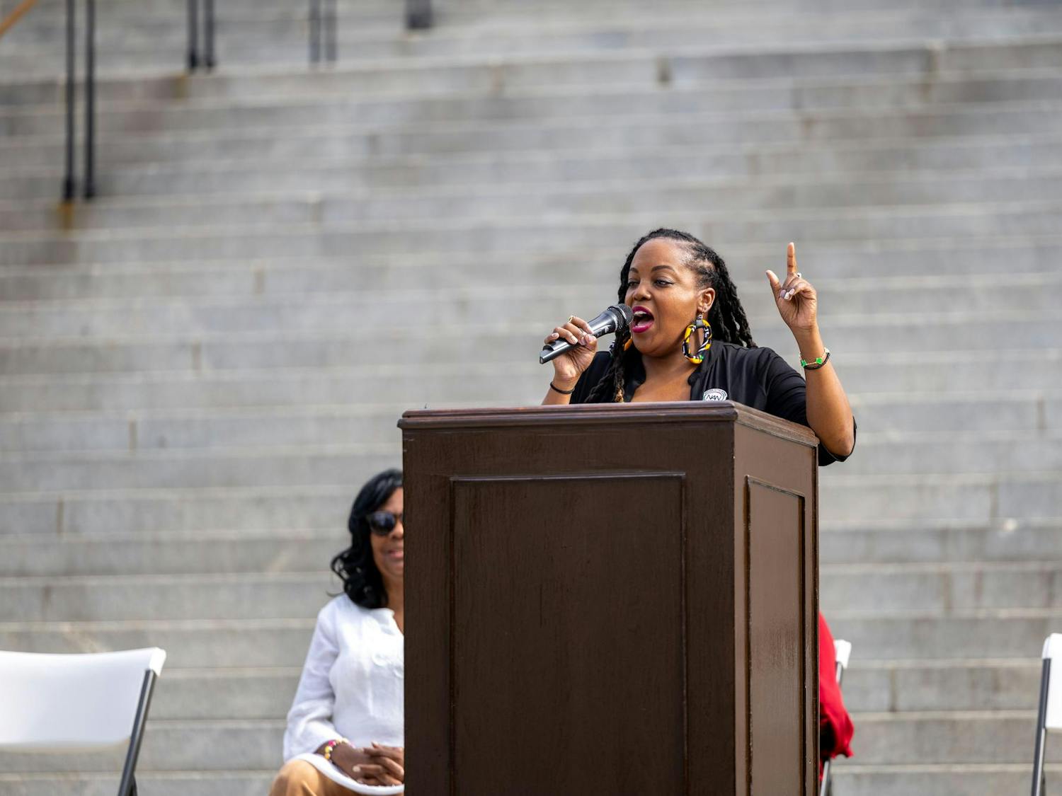 Tiffany James, the emcee for the peaceful rally, speaks to the crowd on the statehouse steps on Sept. 18, 2024. The 'Hate is Not Welcomed in South Carolina' event was a peaceful protest to show the importance of respect, inclusivity and peaceful opposition to hateful rhetoric.