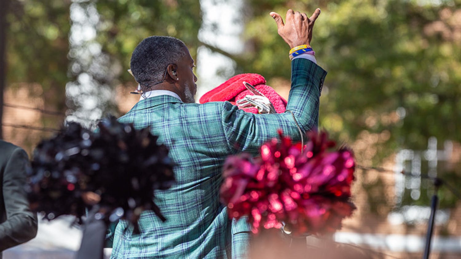 Roman Harper gives a Spurs Up signal at the end of the SEC Nation morning show on Nov. 19, 2022. Harper played safety for Alabama and the New Orleans Saints.