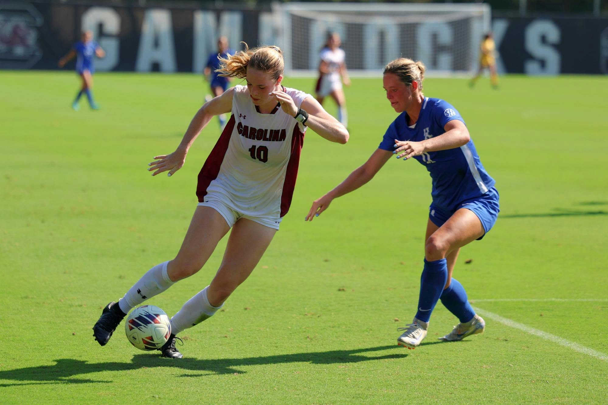 FILE — Fifth-year forward Catherine Barry dribbles a ball next to a Kentucky defender during a match on Sept. 22, 2024. The Gamecocks lost the SEC Tournament Title game to No. 21 Texas on Sunday afternoon.