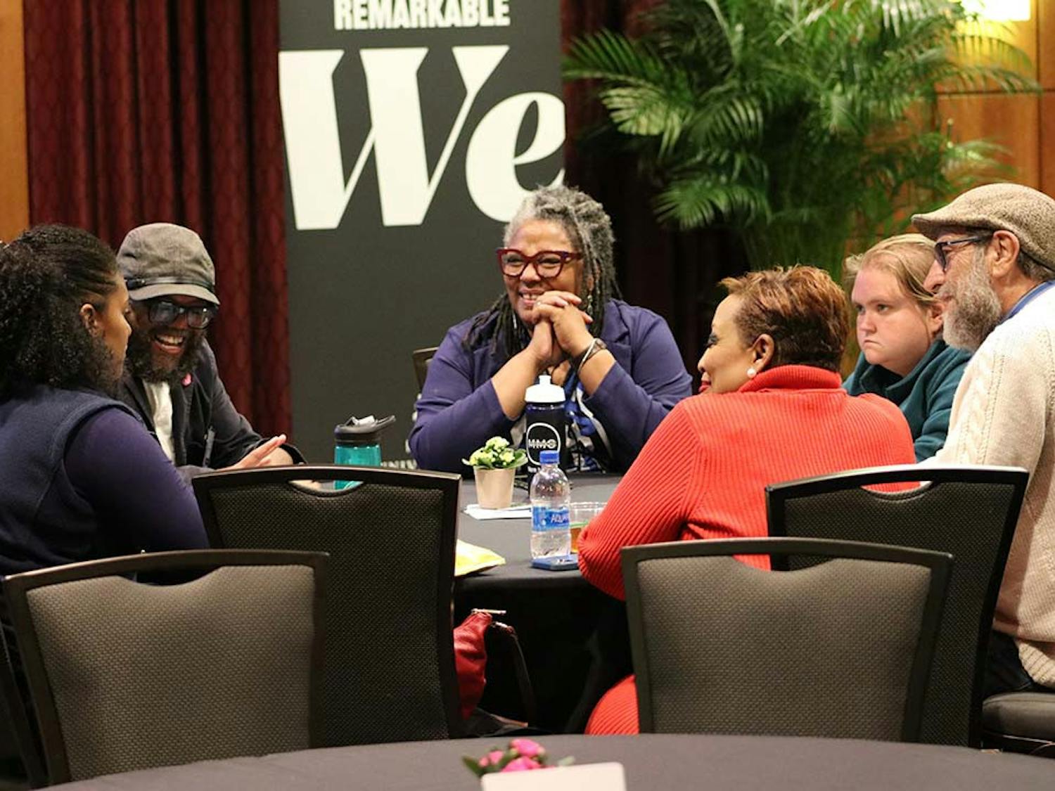 Midlands Mediation Center Kabrina Bass talks with summit guests following the Equity Bus Tour on Nov. 10, 2022. The group's discussion revolved around why they felt spatial inequality existed in Columbia.