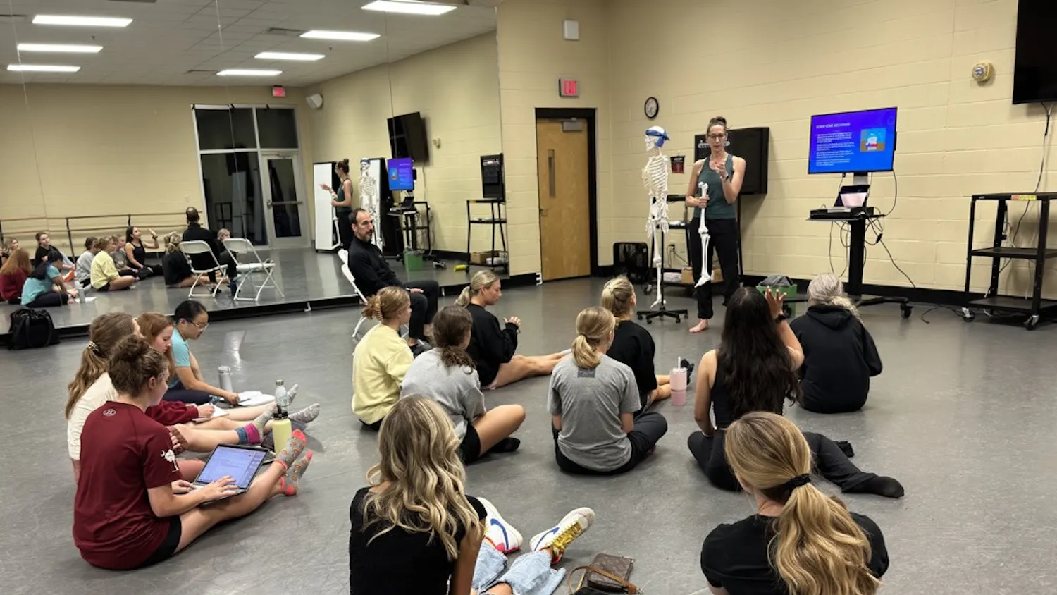 Members of the Carolina Dance and Science club listen intently to Jennifer Deckert’s presentation on knee rotation on Sept. 27, 2022.