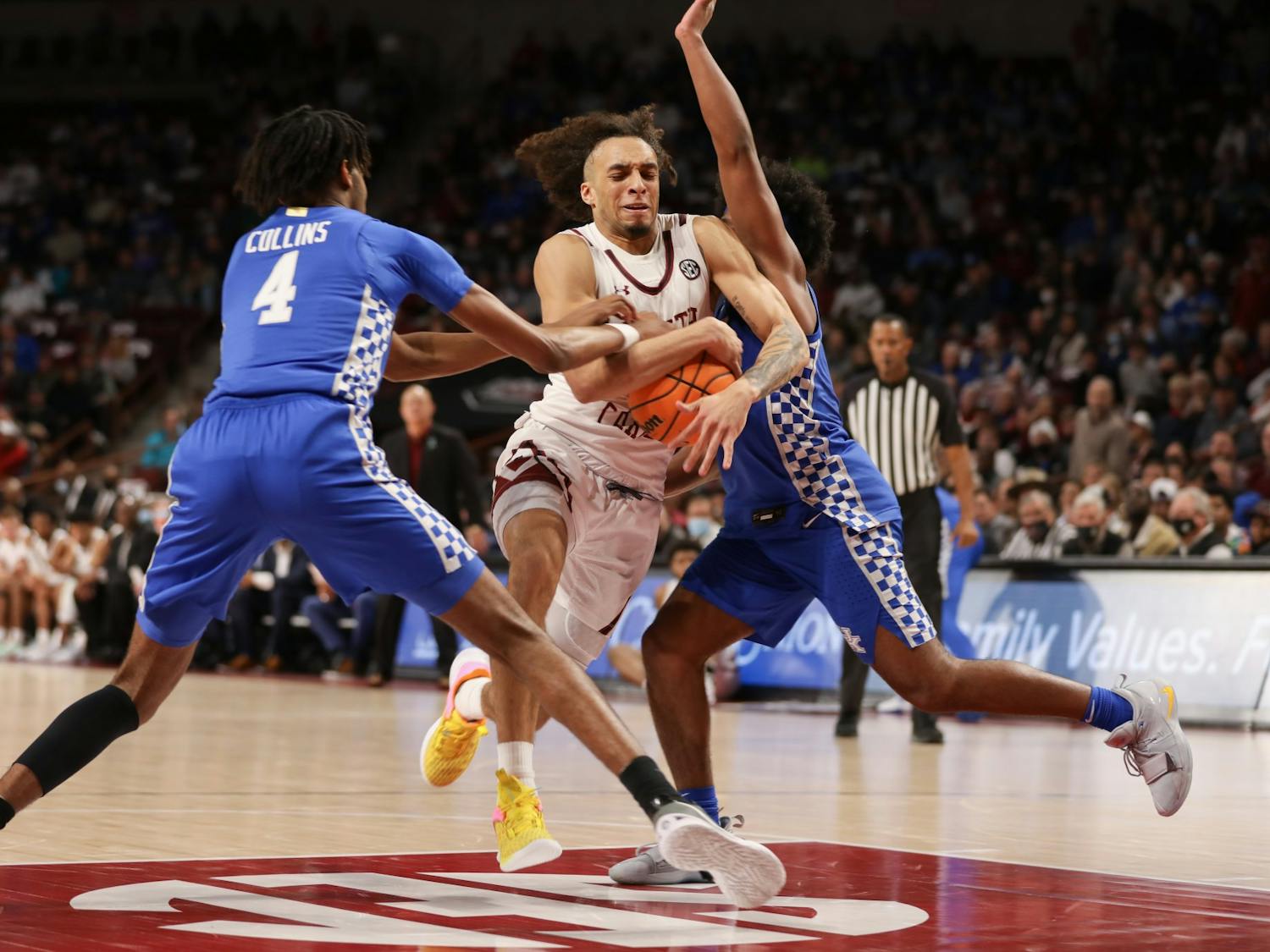 Freshman guard Devin Carter tries to maintain possession amongst the Kentucky defense on Feb. 8, 2022 at Colonial Life Arena. South Carolina lost to Kentucky 86-76.
