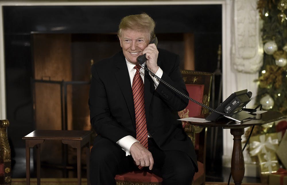 U.S. President Donald Trump in NORAD Santa Tracker phone calls in the East Room of the White House on Dec. 24, 2018 in Washington, D.C. (Olivier Douliery/Abaca Press/TNS) 