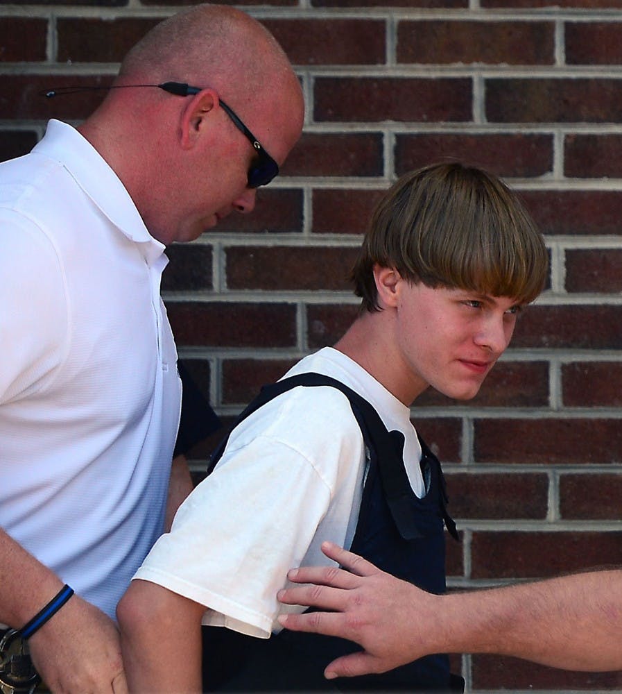Charleston shooting suspect Dylann Roof is escorted from the Shelby Police Dept. Thursday, June 18, 2015 in Shelby, N.C. Jury selection is underway in September of 2016 in Charleston, SC. (Todd Sumlin/Charlotte Observer/TNS) 