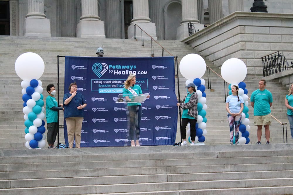 A photo illustration of Miss South Carolina near the statehouse speaking on April 1, 2023. Pathways to Healing advocates for and supports survivors of sexual assault and abuse.
