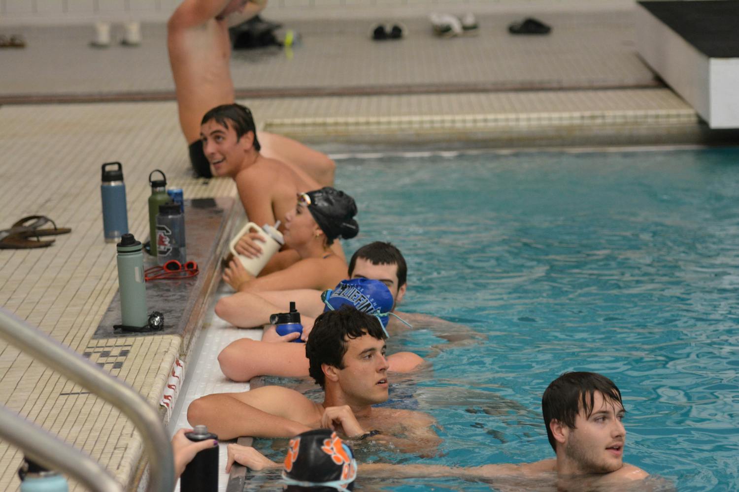Members of Gamecock club water polo gather at the edge of the pool while practicing on Oct. 3, 2023, at the Solomon Blatt Physical Education Center. The club will be competed in its first conference matches since its resurgence in 2020.