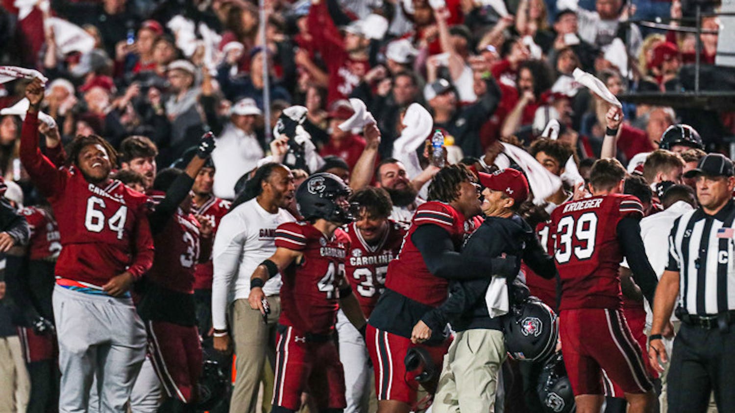 Head coach Shane Beamer gets a hug from freshman defensive lineman D’Andre Martin after the Gamecocks score against the Texas A&M Aggies at Williams-Brice Stadium on Oct. 23, 2022.