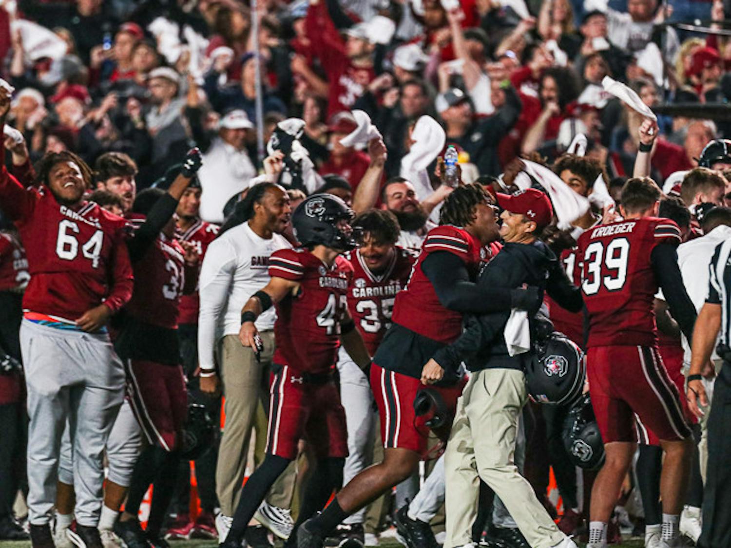 Head coach Shane Beamer gets a hug from freshman defensive lineman D’Andre Martin after the Gamecocks score against the Texas A&M Aggies at Williams-Brice Stadium on Oct. 23, 2022.