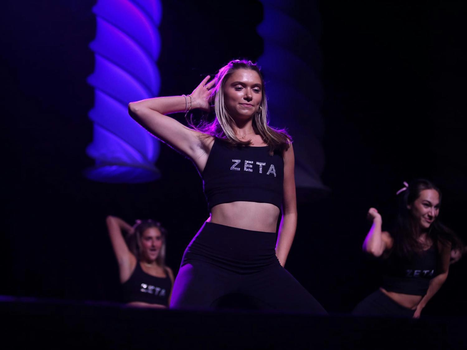 A sister of Zeta Tau Alpha performs on stage at the Columbia Metropolitan Convention Center. She participated in Spurs and Struts, an annual dance competition held by USC Homecoming as a part of Homecoming week events.