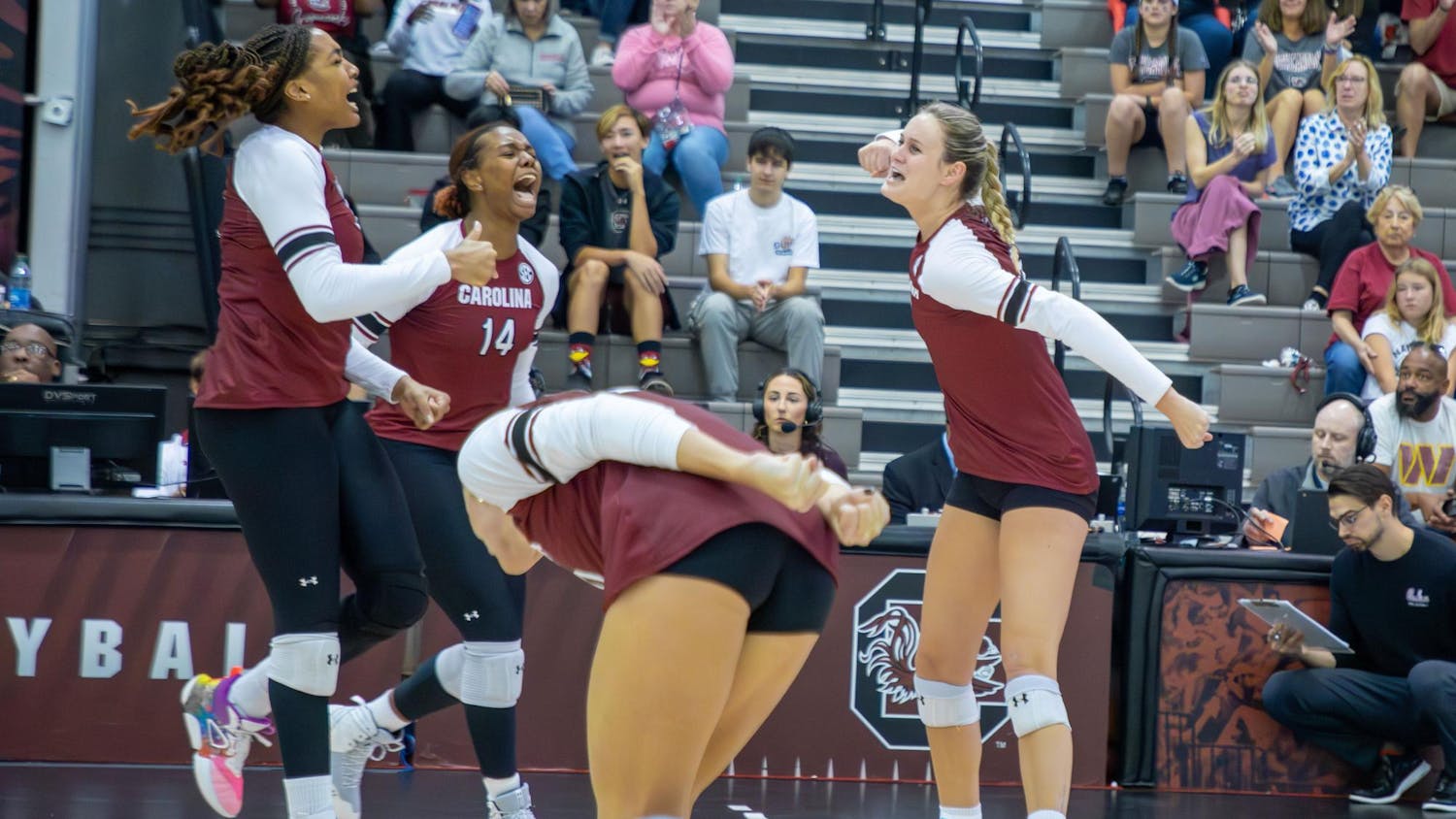 Senior opposite hitter Kiune Fletcher, junior middle blocker Oby Anadi and junior setter Claire Wilson celebrate after winning the second set 25-19 over Ole Miss on Nov. 5, 2023. The Gamecocks defeated the Rebels in three sets at home on Senior Day.