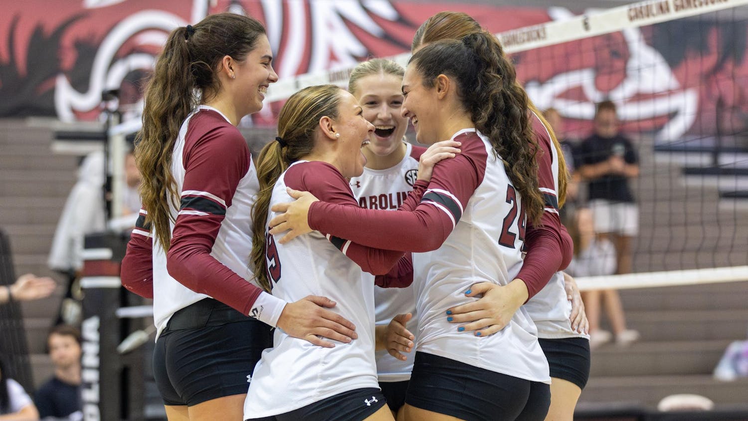 FILE — The Gamecocks celebrate in a huddle after a successful point during their matchup against the Hatters at the Carolina Volleyball Center on Sept. 13, 2024.
