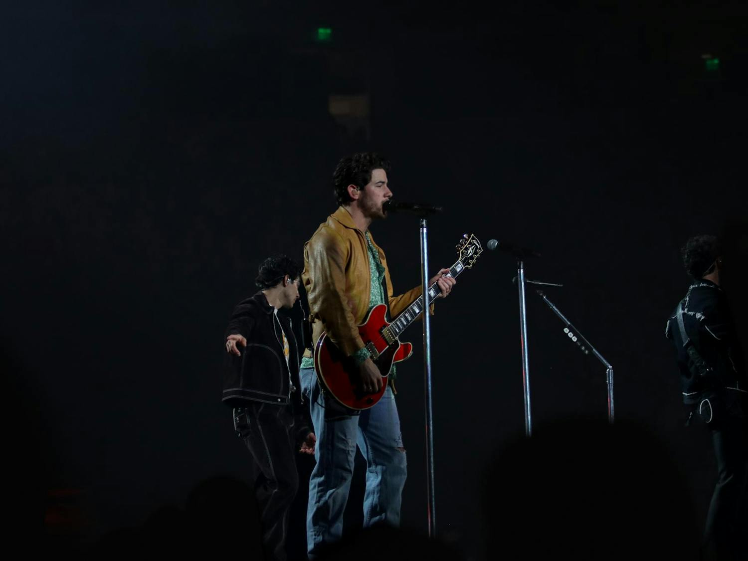 Nick Jonas sings "S.O.S." with his brothers Kevin and Joe during The Tour on Oct. 10, 2023. Nick has four solo albums in addition to the six albums that he has recorded with the Jonas Brothers.