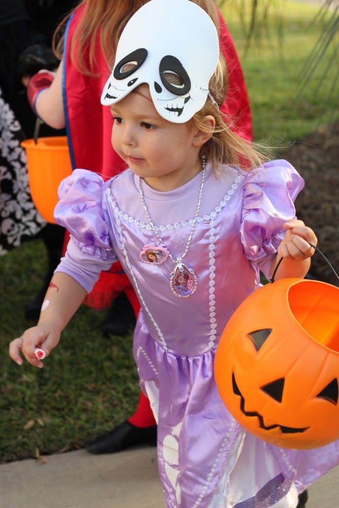 Children of USC faculty and staff as well as the surrounding neighborhood participating in Trick-or-Treat with the Greeks, an annual event where students from Greek organization give out candy and play games with the children.
