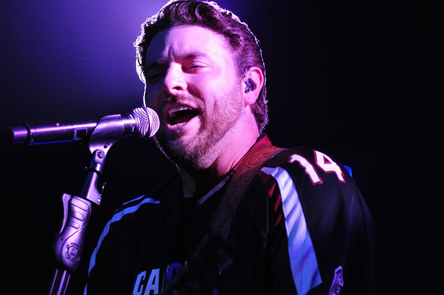 	Chris Young donned a Connor Shaw jersey when he took the stage Sunday night. 