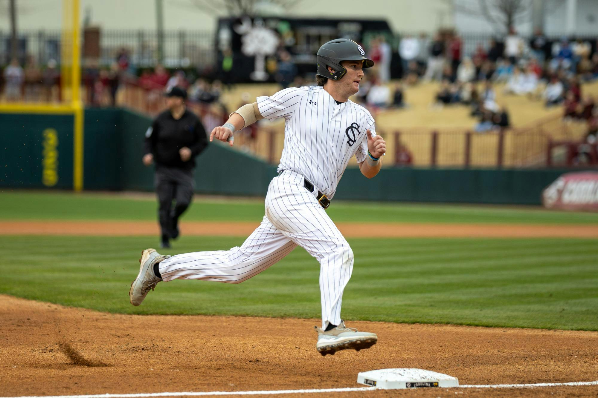 Senior catcher Talmadge LeCroy rounds third base on a hit ball in a game against Sacred Heart University on Feb. 15, 2025 at Founders Park. LeCroy later scored on a fly out from senior outfielder Dalton Mashore.&nbsp;&nbsp;
